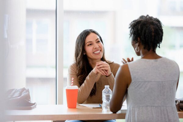 Concept of woman meeting with her boss to discuss professional development
