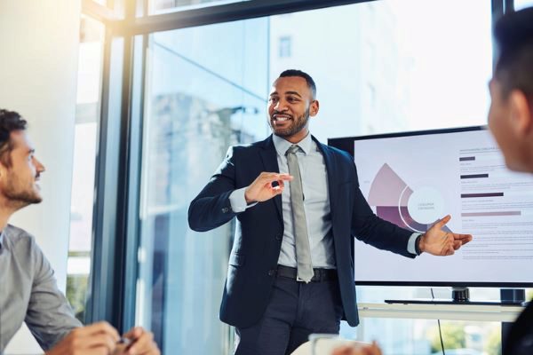 young businessman presenting to his colleagues