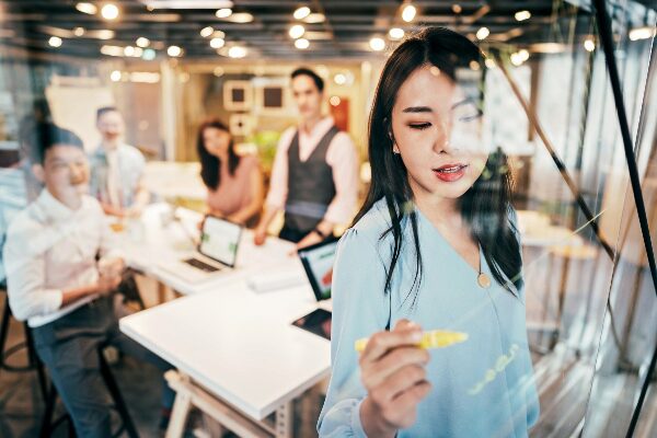 Businesswoman presenting her ideas to a team