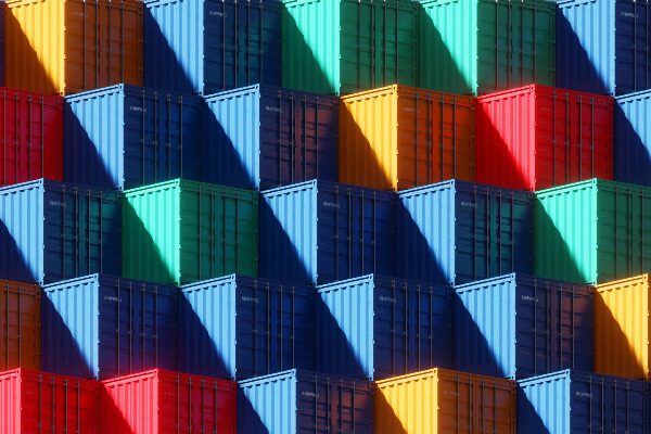 Stacked shipping containers in primary colors