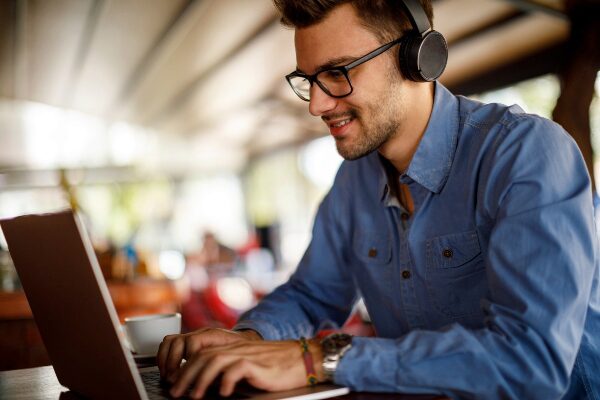 Concept of young man using laptop for online learning