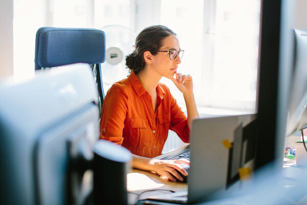 Business woman working at her desktop computer